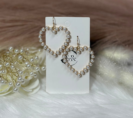 Pearl lined heart dangle earrings